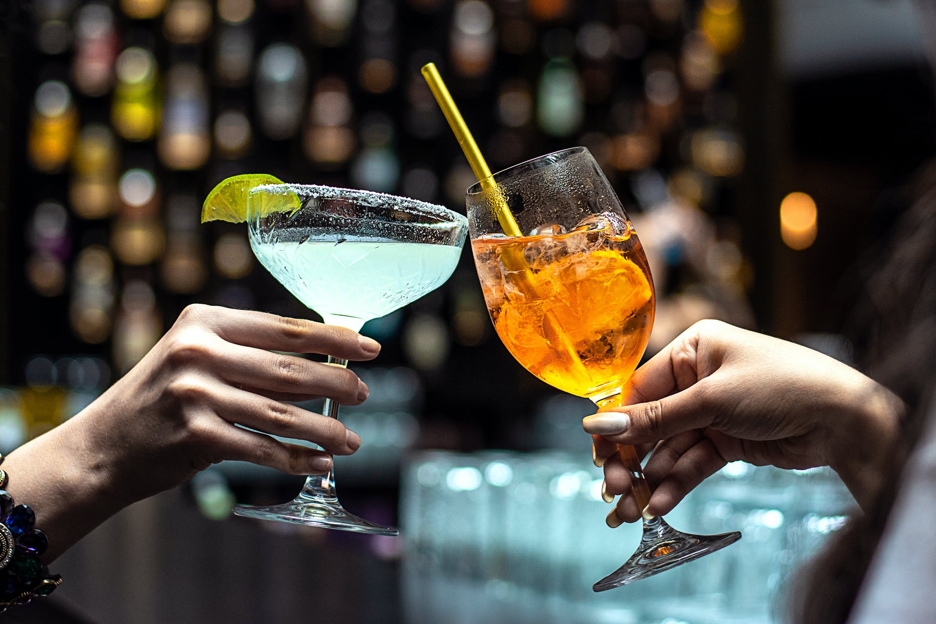 photo of people holding glasses